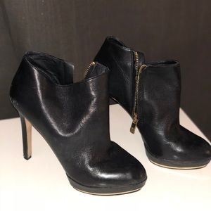Vince Cameron black and gold booties
